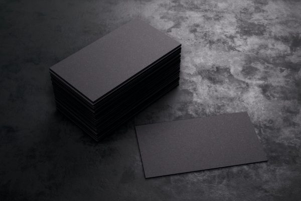 3D rendering of business card. Blank template black Business Cards on black background.